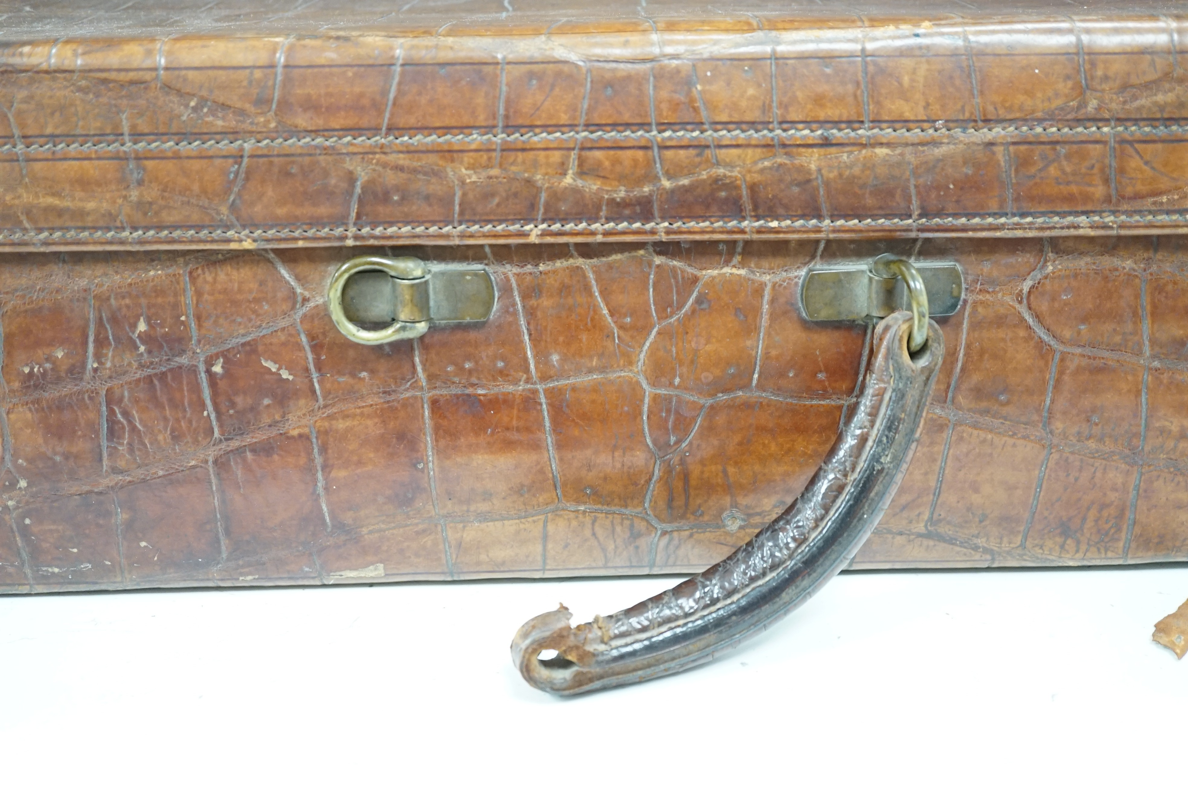 An early 20th century crocodile skin suitcase - 60cm wide